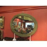 An early 20th Century oval wall mirror,