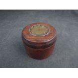 An Oriental lidded compass with brass plaque to top