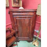 A Victorian flame mahogany corner cupboard with cushion drawer over door,