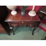 An 18th Century crossbanded mahogany low boy the single long drawer over two short,