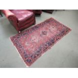 A brown ground Eastern rug,