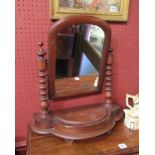 A Victorian mahogany toilet mirror, turned supports,