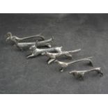 Six assorted metal animal knife rests including peacocks