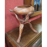 An Eastern hardwood bowl supported by bone inlaid animal carved base