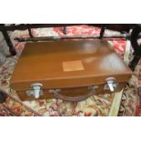 A light tan small leather cowhide suitcase - no key