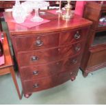 A circa 1940 flame mahogany bow front chest of two short over three graduating long drawers on