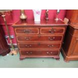 A Georgian mahogany chest of two over three drawers with cross banded detail to top and drawer