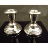 A pair of silver squat form candlesticks, Birmingham 1973,