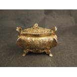 An Edward James Watherston silver gilt lidded casket with twin handles and floral embossed detail,