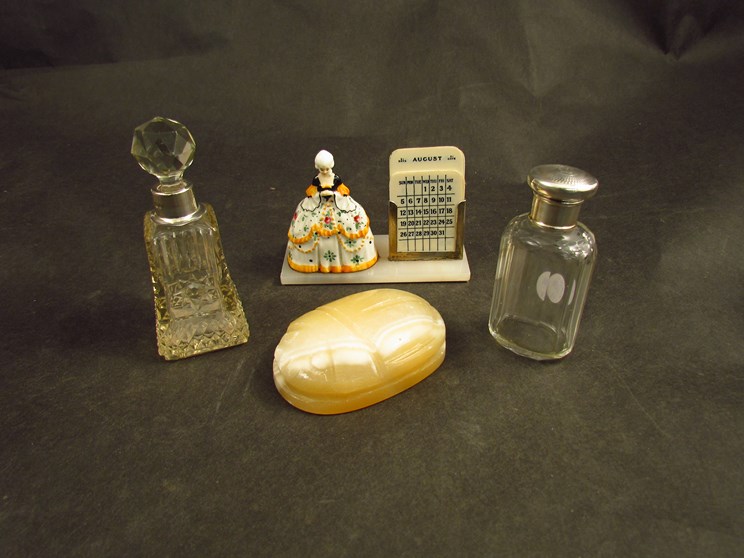 Two glass perfume bottles one with silver collar marked London,