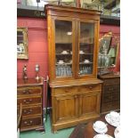 A Victorian walnut library bookcase with two drawer over two door base