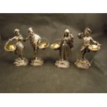 A set of four Asprey and Garrard silver figural salts, the two male and two females in period dress,