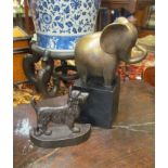 A cast metal door stop in the form of a terrier dog together with an elephant bookend/door stop