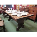 A large oak refectory table and four ladder back chairs,