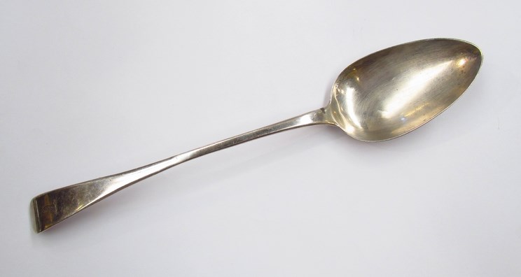 A Christopher & Thomas Wilkes Barker silver serving spoon, crested handle, London 1803,