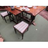 Two William IV rosewood balloon back dining chairs with stripe upholstered seats,