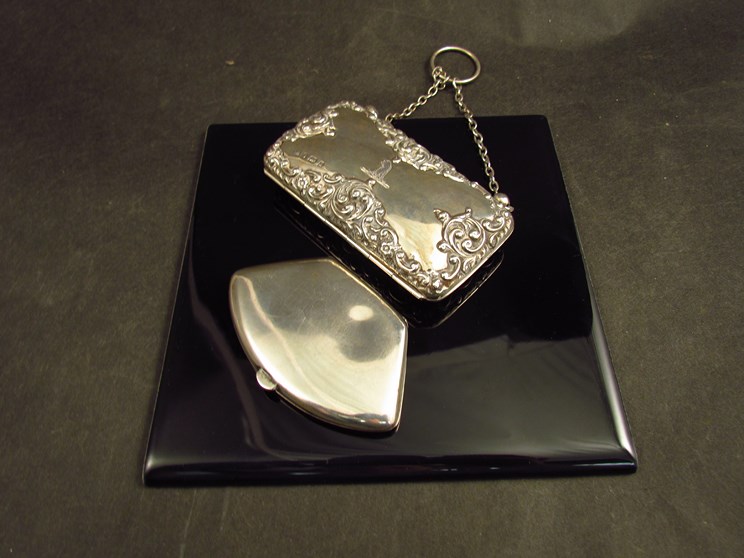 A silver game marker case, Birmingham and a silver purse,