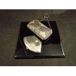 A silver game marker case, Birmingham and a silver purse,