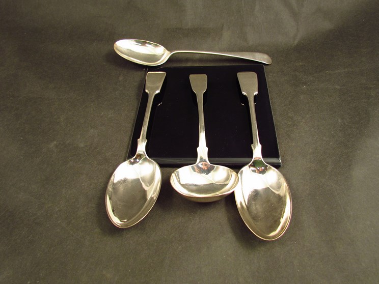 A John & Henry Lias silver ladle, London 1844, a William Hatton & Sons silver tablespoon,