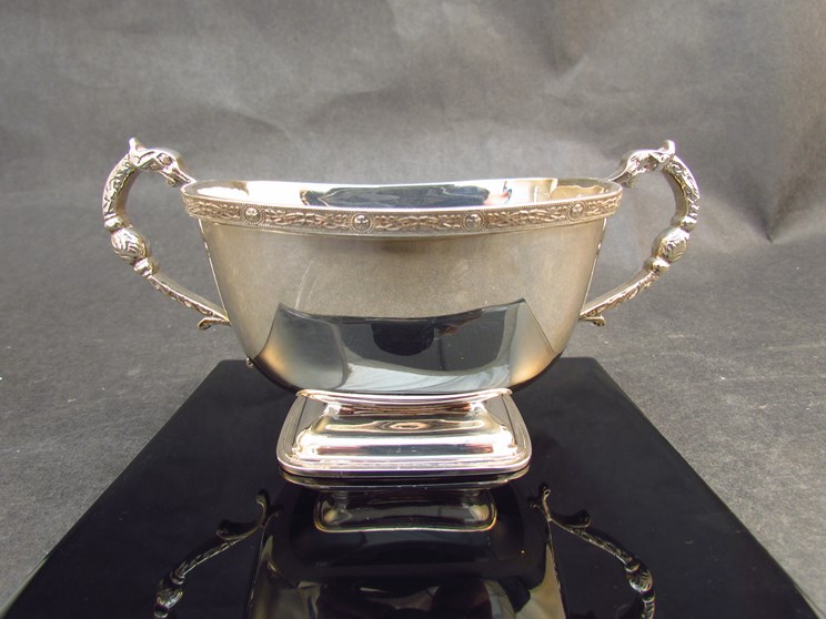 A Poston Products silver twin handled sugar bowl - Celtic revival style, dragon head handles,