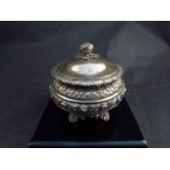 A Rebecca Emes and Edward Barnard I silver circular tea caddy, embossed borders, floral knop,