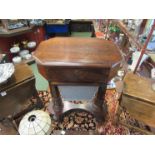 A Victorian rosewood sewing/work table with octagonal top over drawer,