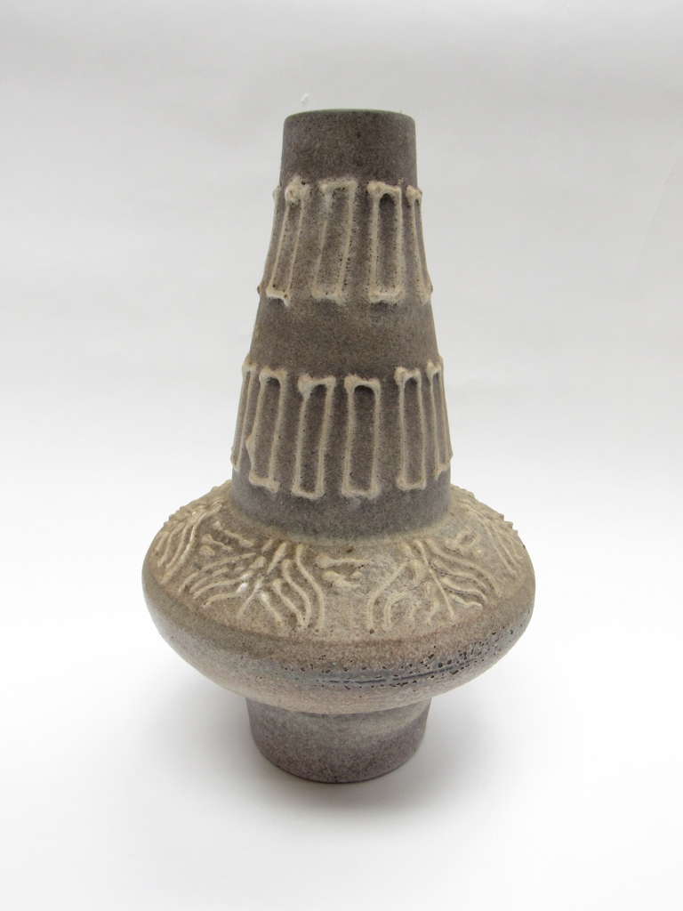 A West German pottery vase, grey lava glaze with white relief line detail.