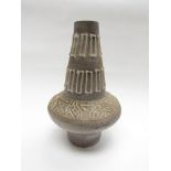 A West German pottery vase, grey lava glaze with white relief line detail.