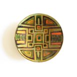 A Poole studio dish, green ground with abstract design in green, orange and black. Blue back stamp.