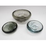 Two Per Lutken Holmegaard off set scoop dishes in blue and smoked glass and a Whitefriars smoked