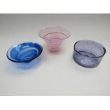 A blue glass dish signed Vas Vitreum and two other glass dishes in amethyst and pink