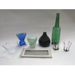 A collection of assorted glassware including a large green glass fish bottle vase,