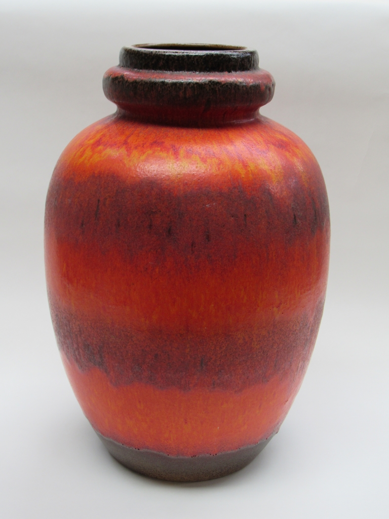 A West German floor standing Fat Lava ceramic vase with red and orange glaze,