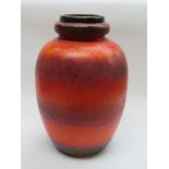A West German floor standing Fat Lava ceramic vase with red and orange glaze,