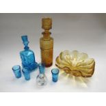 Two moulded glass decanters, one blue car form,