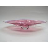 A cranberry and white art glass dish.