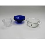 A moulded glass Kosta dish and two other glass dishes in clear and blue