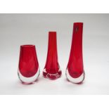 Three Whitefriars ruby bud vases, tallest 25.