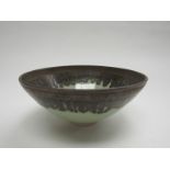 BILL MOORE (b1969) A studio porcelain bowl, green glaze with manganese rim. Impressed seal.