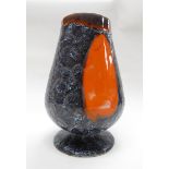 A Vallauris Pottery goblet form vase with grey and orange lava glaze. 30cm high.