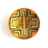 A Poole Studio dish, orange ground with abstract design in green and black. Blue back stamp.