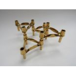 Four Nagel gold painted interchangeable candle holders,