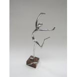 A contemporary aluminium dancing figure on marble base