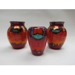 A pair of Poole Volcano range bulbous vases and another.