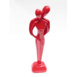 A red laquered and plaster figural group of man and woman 54cm high