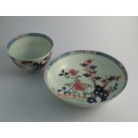 A Lowestoft Redgrave pattern tea bowl and saucer,