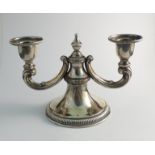 A Continental silver twin sconce candlestick with acanthus scroll branch arms,
