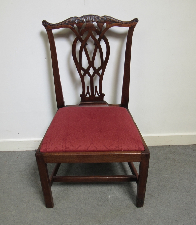 A George III mahogany chair with carved and pierced central splat