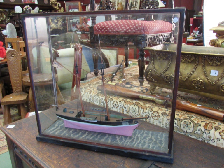 A late 19th Century hand built model of a sail ship with British colours flying in glass case,