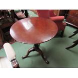 An early George III mahogany tilt top wine table with birdcage action the revolving top on a turned